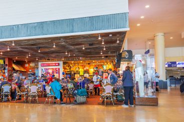 Travelers dining in restaurant and shopping at store