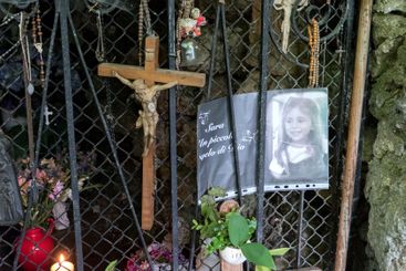 Religious and Christian objects and candles on the...