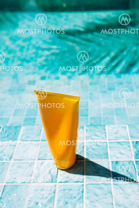 A mock-up of a yellow tube for sunscreen. Cosmetic...