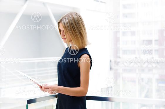business woman holding reports. Copy space