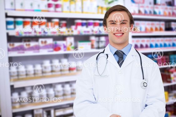 Composite image of young doctor using tablet pc