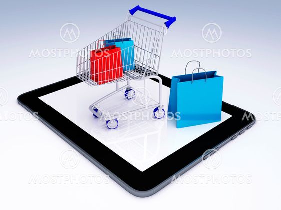 Shopping Cart over Tablet PC. E-commerce Concept.