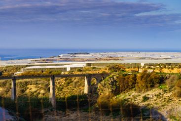 Plastic greenhouses on coast, Spain