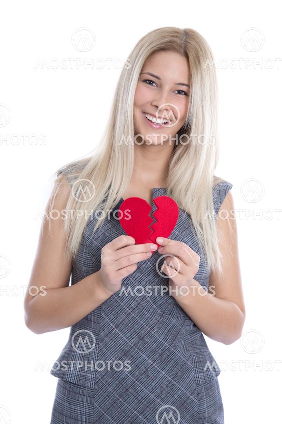 Happy young blond caucasian woman holding red heart -...