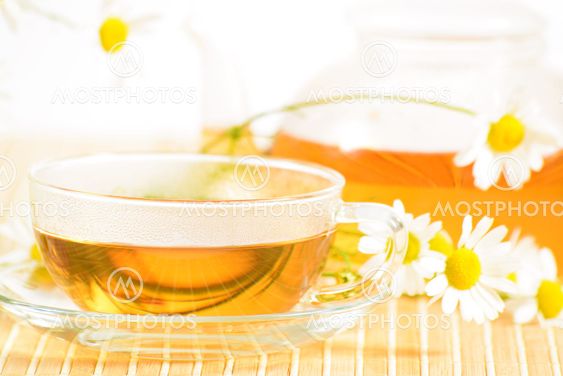 teacup with herbal chamomile tea
