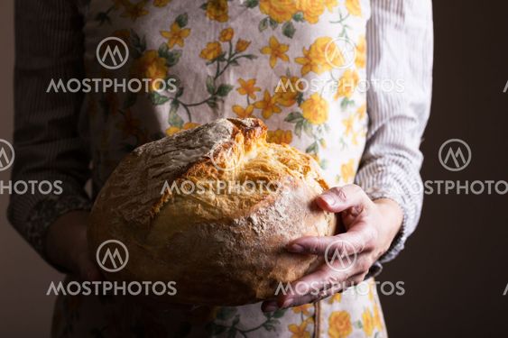 girl holding fresh white bread