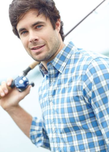 Holiday, man and fishing pole at river for vacation,...