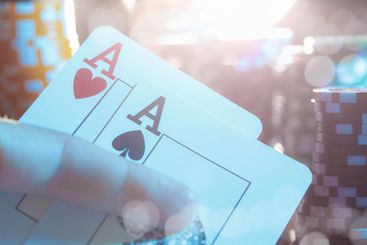 Poker game set of cards and chips close up