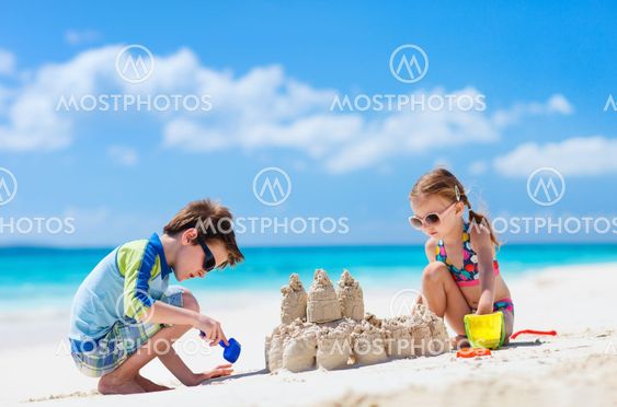 Two kids playing at beach