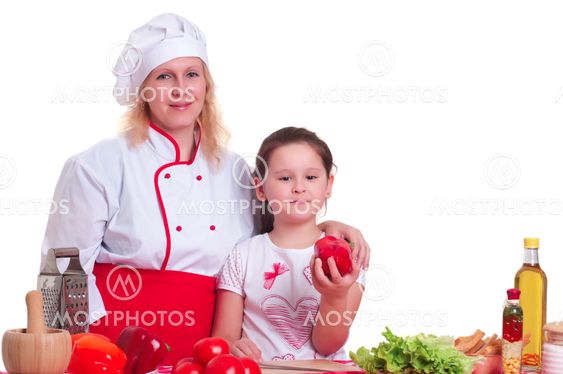 Mother and daughter cooking dinner