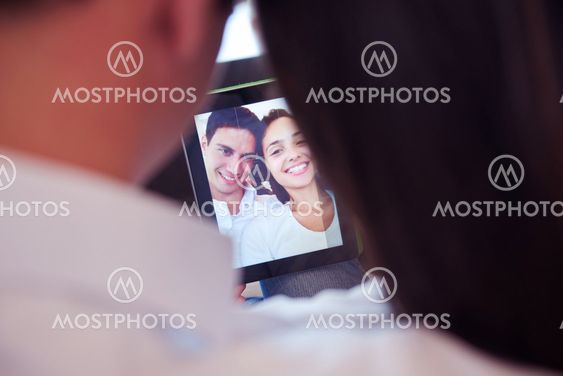couple at modern home using tablet computer