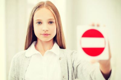 girl showing no entry sign