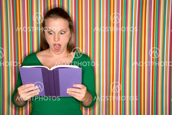 Woman reading book.