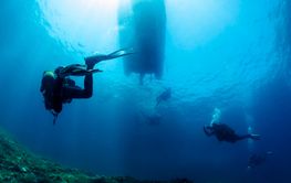 group of people are scuba diving in the ocean