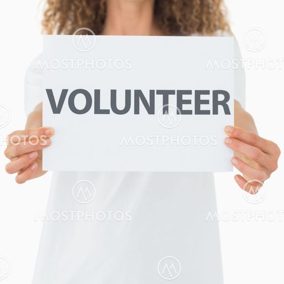 Volunteer showing a poster