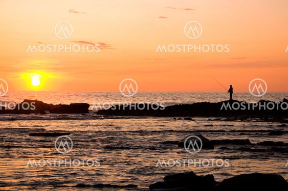 Fisherman on the sunset