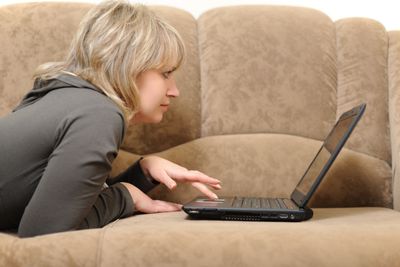 The woman working on laptop at home