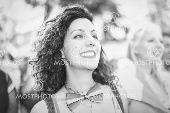 Black and white woman during the pride parade in...