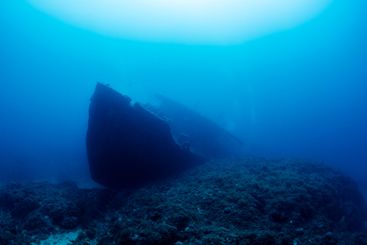 wreck of an old ruined ship on ocean rocky bottom
