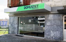 Street view of modern business Domusnet entrance in...