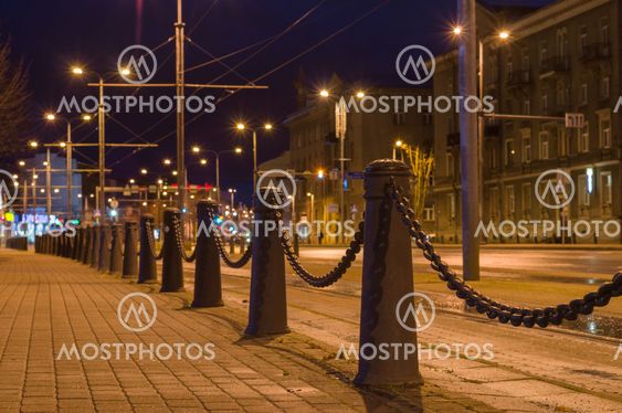 Perspective view of decorative poles and chain