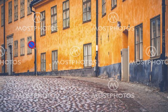 Old parts of Stockhom with cobblestones and orange old...
