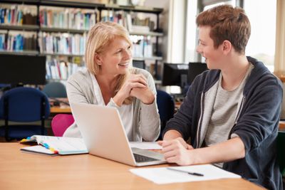 College Student Has Individual Tuition From Teacher In...