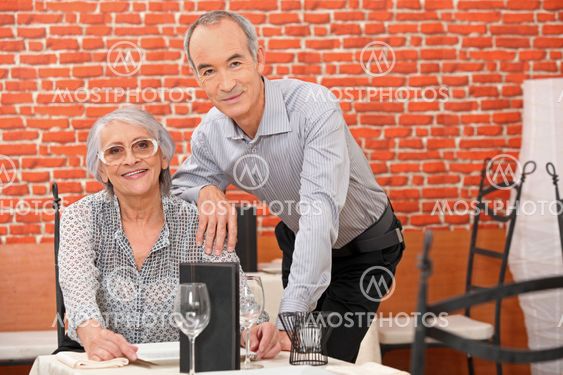 Couple posing in a restaurant