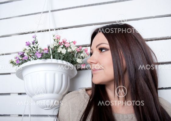 The young girl is engaged in flowers