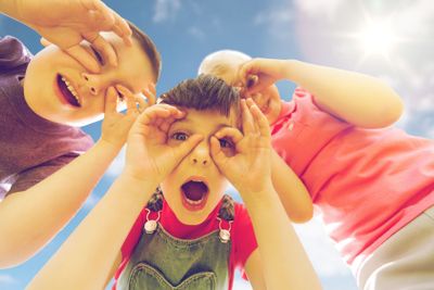group of kids having fun and making faces outdoors