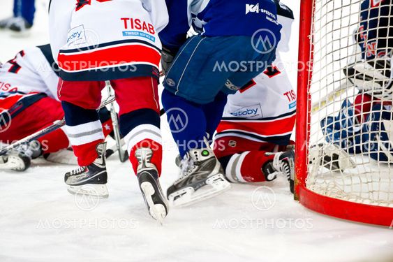Tight in front of goalie.