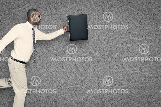 Composite image of businessman running with briefcase