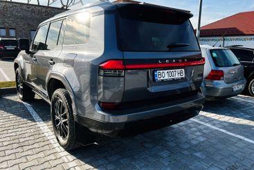Luxury Lexus GX 550 SUV parked outdoors under sunlight...
