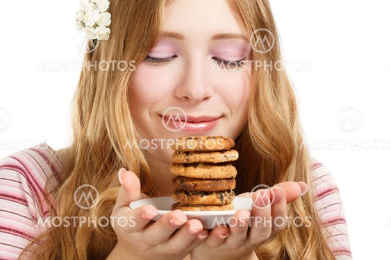 Beautiful young smiling woman with cookies