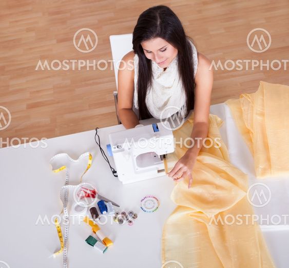 Woman working with her sewing machine