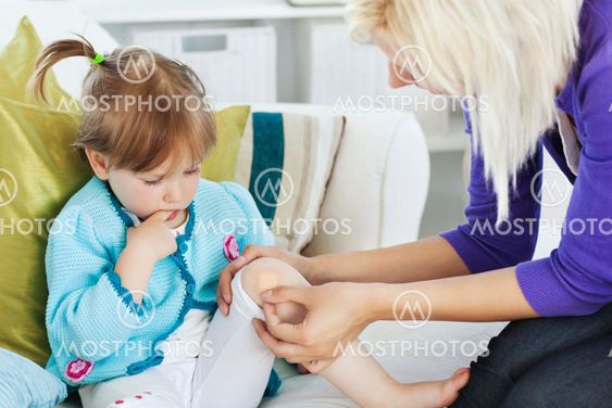 Mother taking care of her injured child