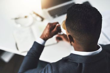 Business, man and coffee with notebook in office for...