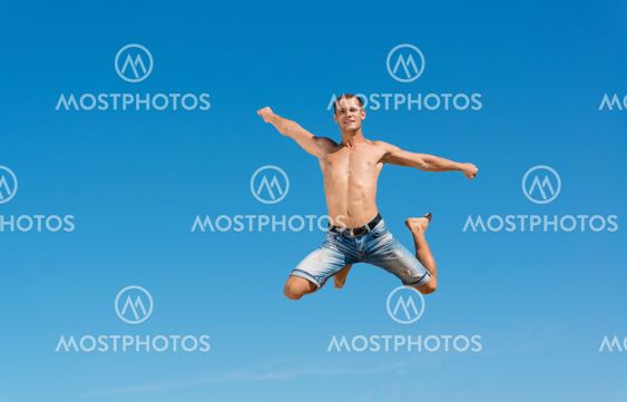 man jumping on the blue sky background