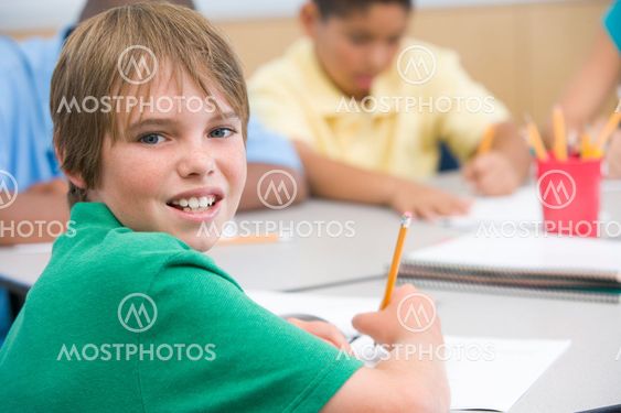 Elementary school pupil writing
