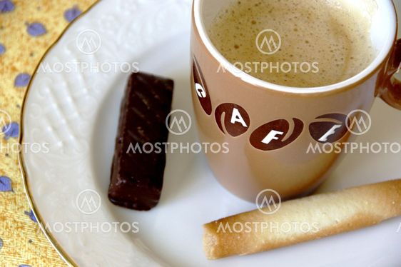 cup of coffee with cookies