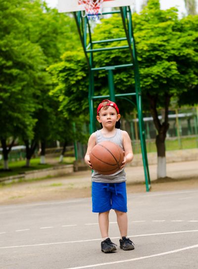 Young boy playing basketball