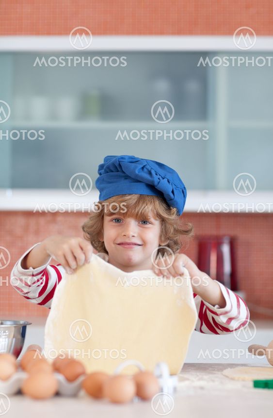 Adorable child baking