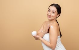 Young woman indulging in a skin care routine at home