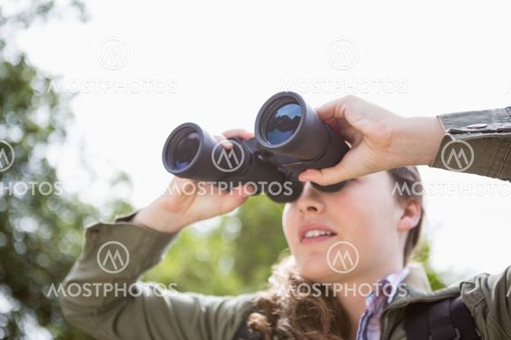 Woman using binoculars