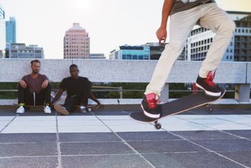 Skateboard, legs and person with ollie flip in air for...