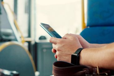 Trip, hands and person with phone on bus for travel...