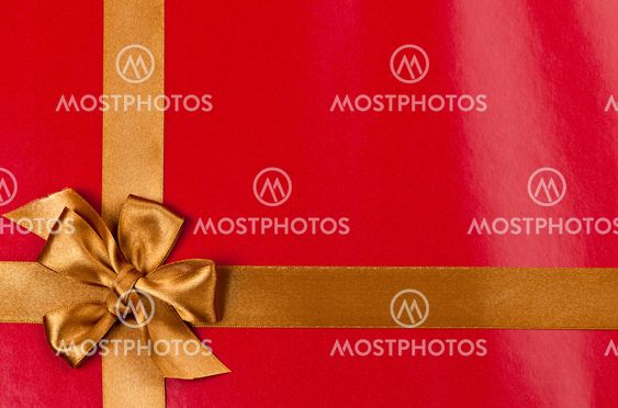 Red gift background with gold ribbon