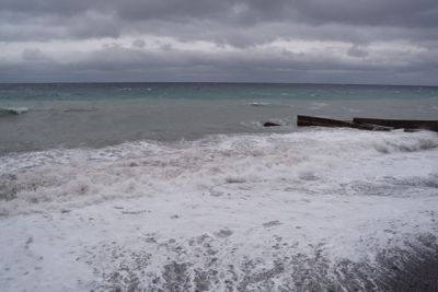 View of storm seascape. Dark moody sky over the gray...