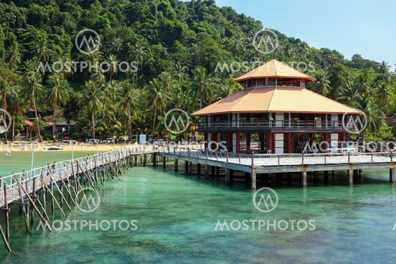 Wooden jetty on exotic beach Koh Chang island, Thailand