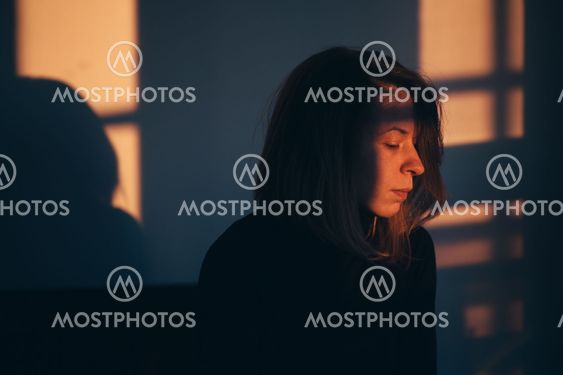 A woman sitting alone and depressed